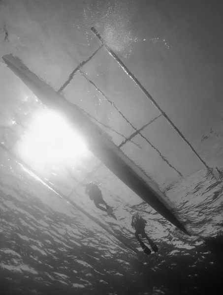 PHILIPPINES, Balicasag Island, U.W. photo, divers reaching a local typical wooden boat - FILM SCAN — Stock Photo, Image