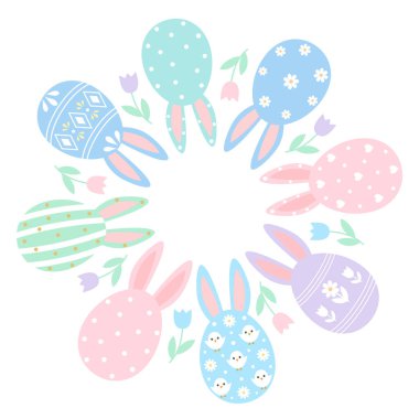 Yuvarlak Paskalya çelengi. Tavşan kulaklı ve bahar çiçekli..