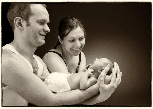 Newborn baby boy on the fathers and mothers hand. — Stock Photo, Image