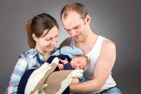 Portrait of a young caucasian couple with three-month old boy — ストック写真