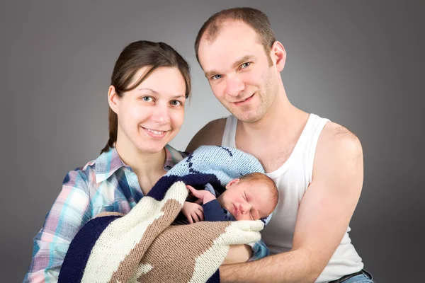 Portrait of a young caucasian couple with three-month old boy — ストック写真