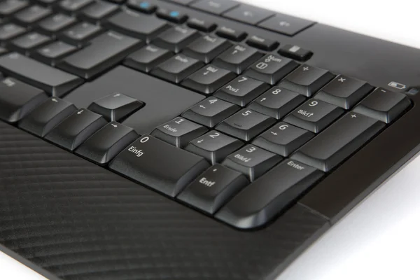 Частина чорної клавіатури, ізольована на білому — стокове фото