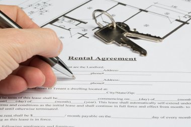 Detail view from filling out a rental agreement clipart