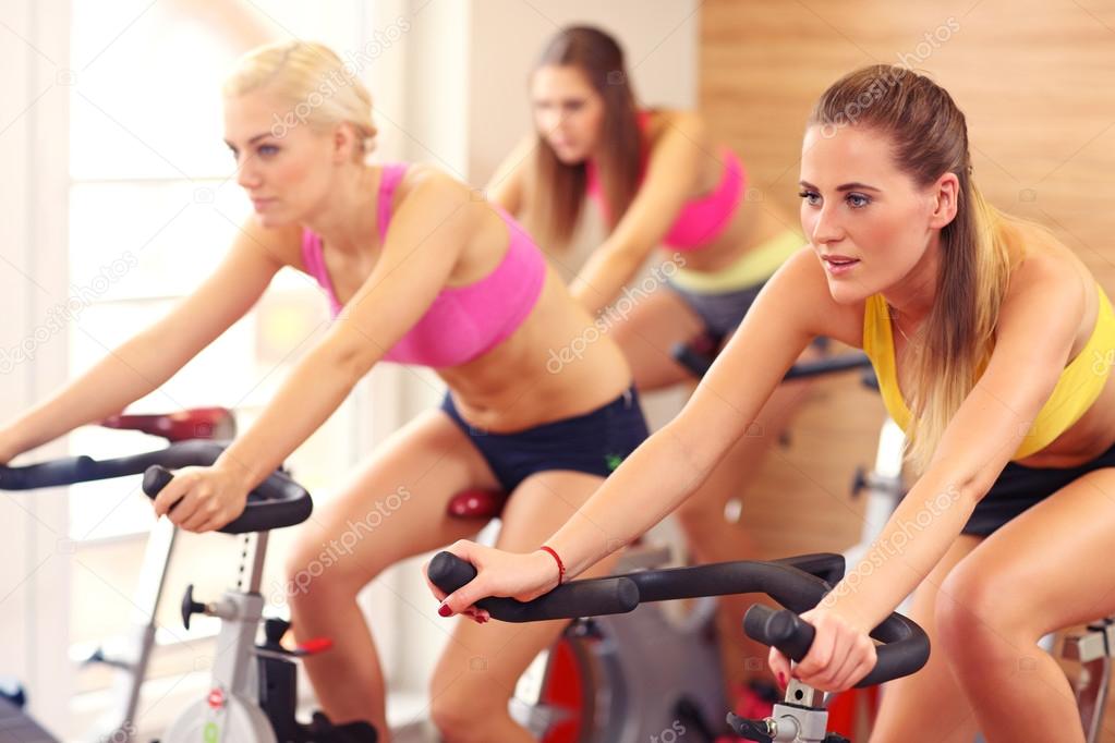 Sporty women on spinning class