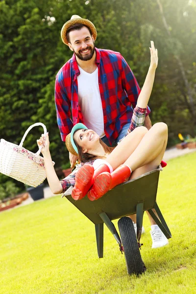 Couple having fun in the barrow — Stock Photo, Image