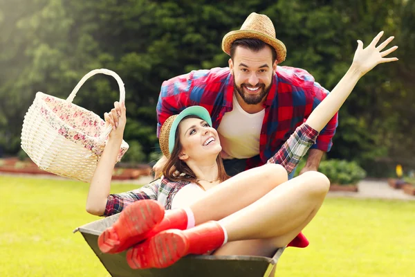 Couple having fun in the barrow — Stock Photo, Image