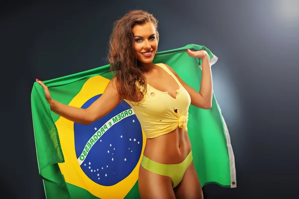 Abanico brasileño feliz animando con bandera —  Fotos de Stock
