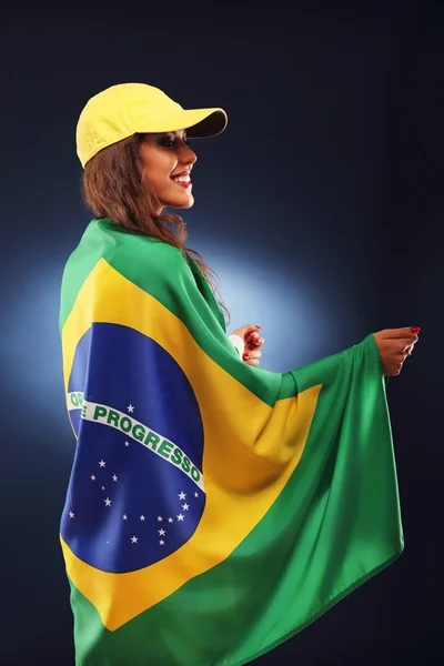 Happy Brazilian fan cheering with flag — Stock Photo, Image