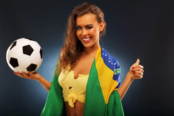 Happy Brazilian fan with flag and football — Stock Photo, Image
