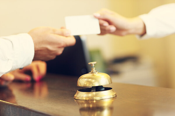 Guests getting key card in hotel