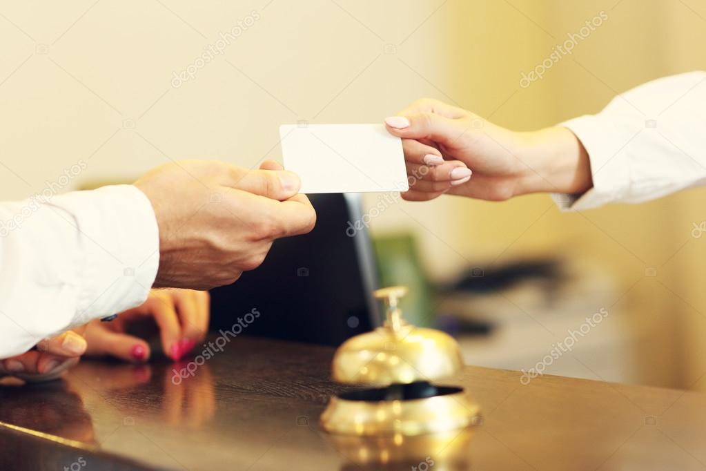 Guests getting key card in hotel