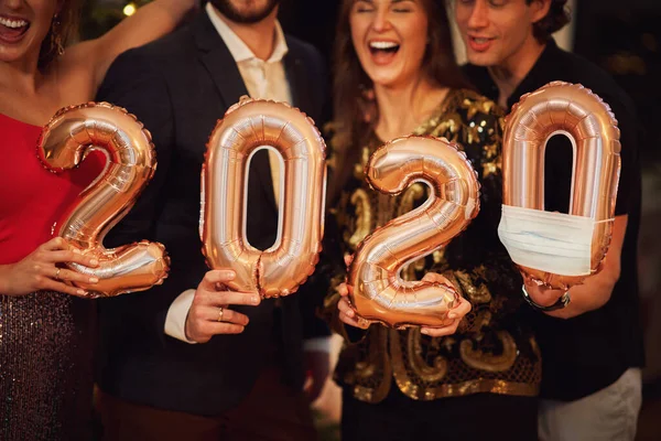 Two beautiful young couples having fun at New Years Eve Party — Stock Photo, Image