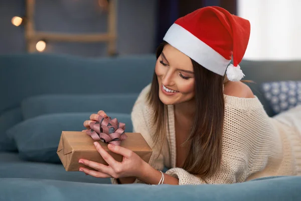 Adult woman with Christmas present at home — Stock Photo, Image
