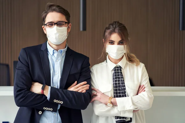 Receptionists wearing mask working in a hotel