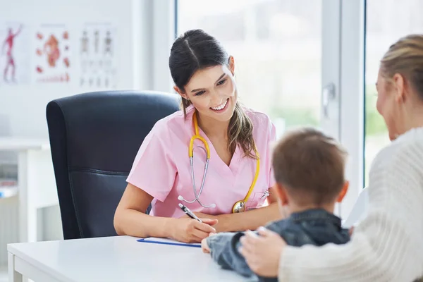 Little boy having medical examination by pediatrician