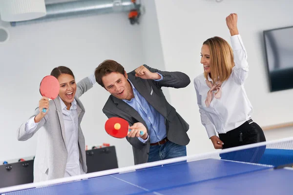 Business people relaxing in shared office space