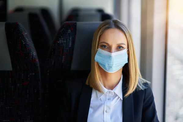 Subway commuter woman in mask on public transport. — Stock Photo, Image