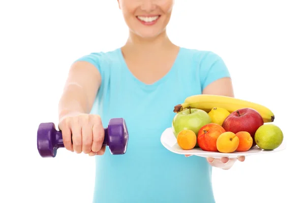 Mulher com frutas e sinos mudos — Fotografia de Stock