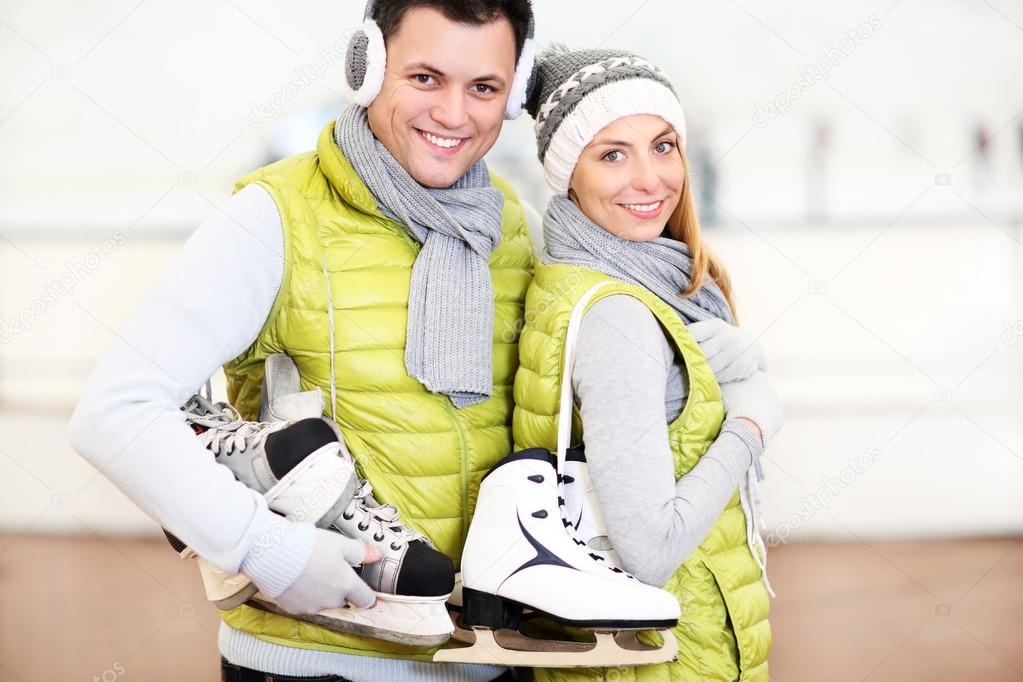 Cheerful couple in the skating rink
