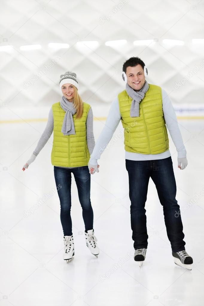 Happy couple ice skating