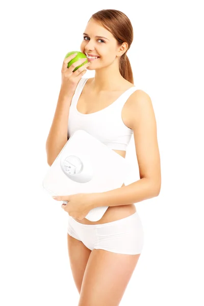 Přizpůsobit žena s apple a koupelna váhy — Stock fotografie
