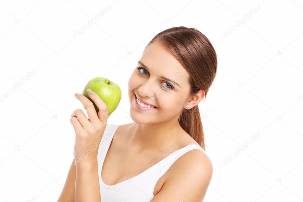 Pretty woman holding green apple