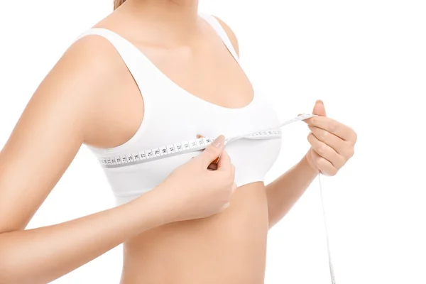 Fit woman measuring her breast — Stock Photo, Image