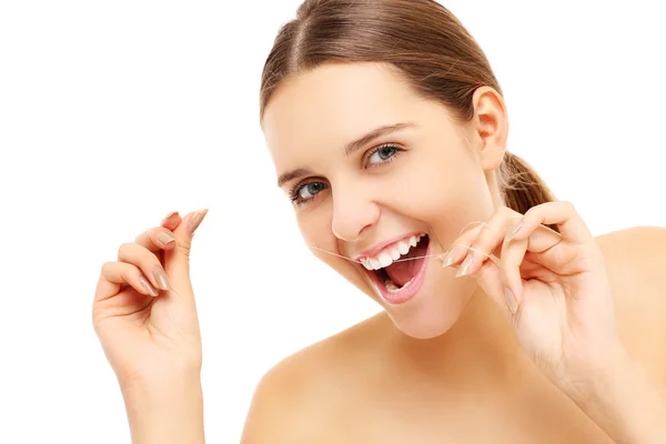 Woman using dental floss — Stock Photo, Image