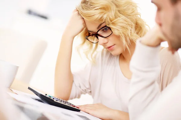 Worried couple with documents at home — Stock Photo, Image