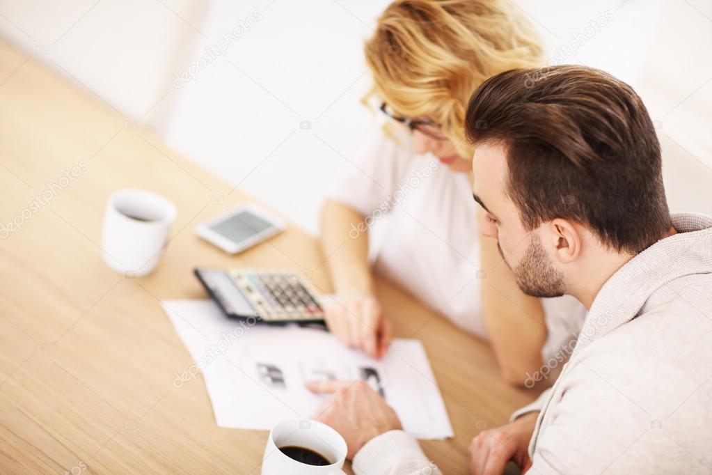 Adult couple working on documents