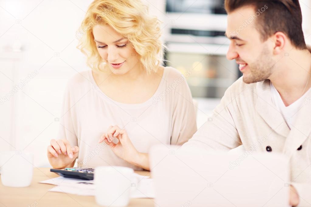 Couple working on home budget
