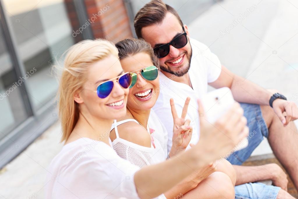 Group of friends taking selfie