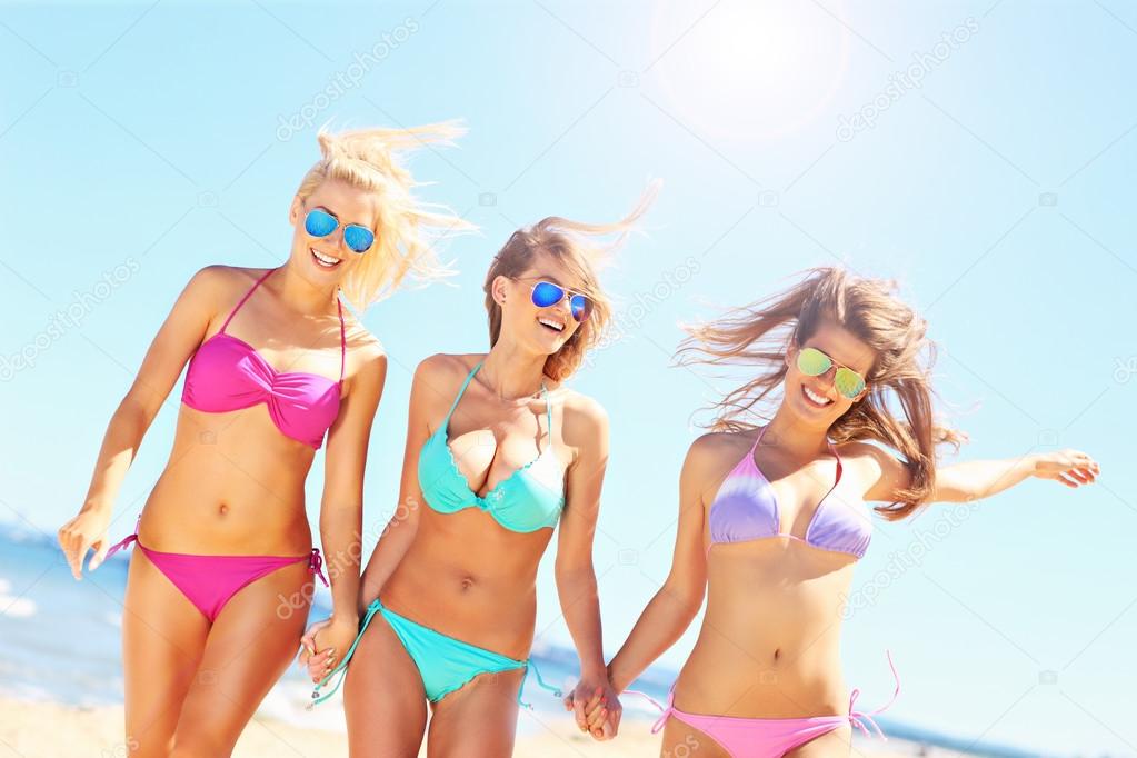 Group of women walking along the beach