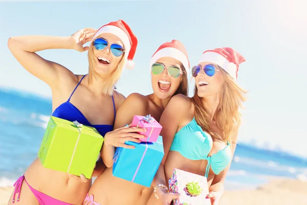 Girls in Santa's hats having fun — Stock Photo, Image