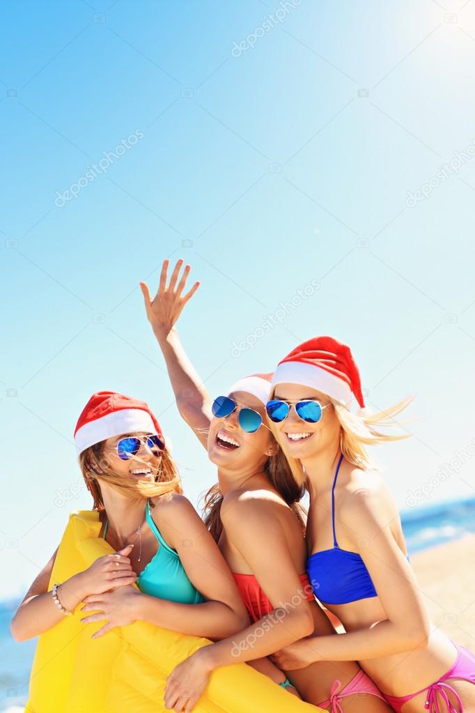 Girls in Santa's hats having fun