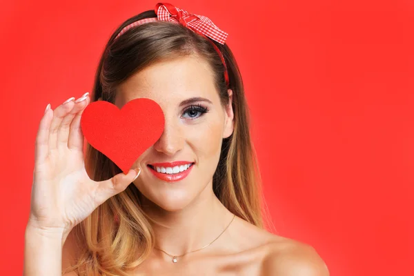 Sexy Valentine woman holding a heart — Stock Photo, Image