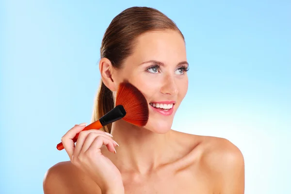 Sensual woman with makeup brush — Stock Photo, Image