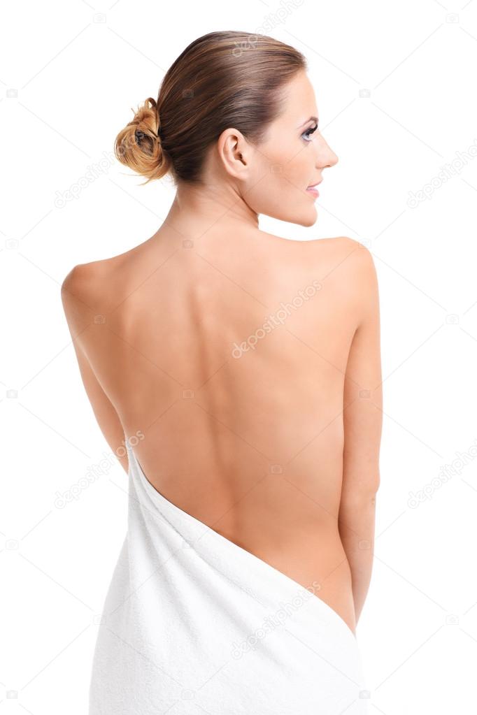 Sensual naked woman with towel