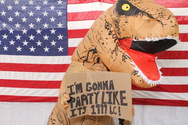 Dinosaur Holds Hand Written Cardboard Sign While Standing Front American — Stock Photo, Image