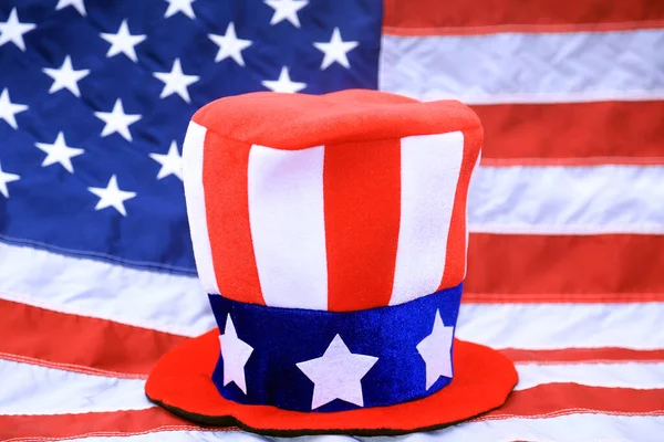 Red White and Blue Patriotic American Hat. Independence Day head ware. American Flag Hat. USA Flag Top Hat. Isolated on white. Party Hat for American Holidays. 4th of July Party Hat. Proud to be American.