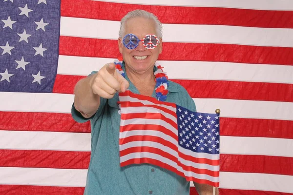 American Independence Day. Happy 4th of July. USA Independence Day. American flag. A man celebrates the 4th of July while in a Photo Booth. American Man in an American Photo Booth. Independence Day Celebration. United States of America.