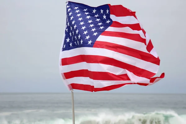 American Independence Day. Happy 4th of July. USA Independence Day. American flag. Forth of July. American Independence Day Celebration. American Flag in the sand on a beach in AMERICA.  America is number one in Freedom and Quality of life.