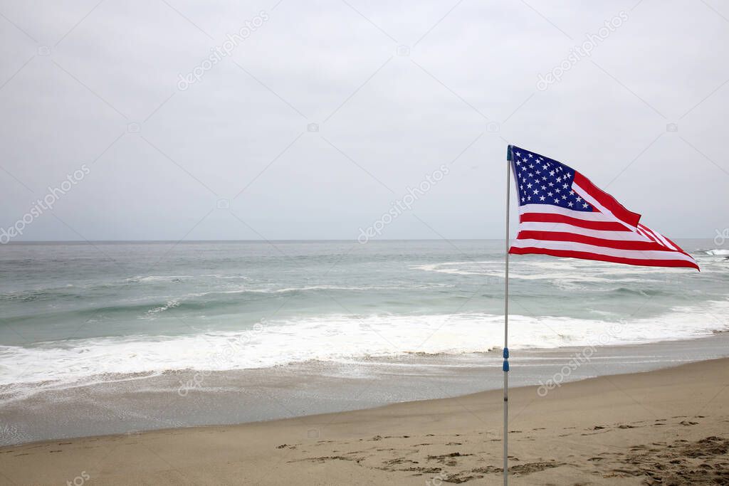 American Independence Day. Happy 4th of July. USA Independence Day. American flag. Forth of July. American Independence Day Celebration. American Flag in the sand on a beach in AMERICA.  America is number one in Freedom and Quality of life.