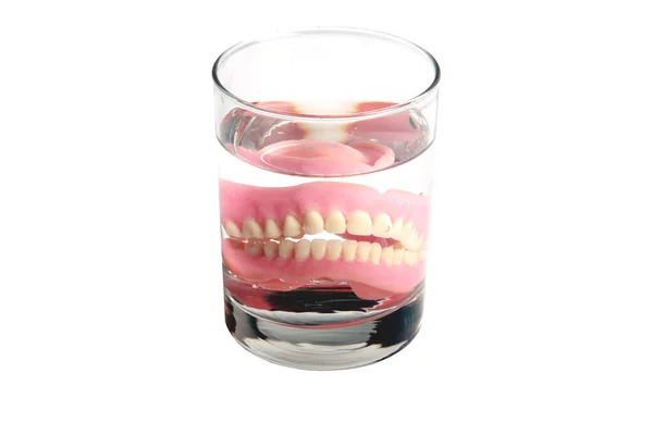 Una Dentiera Bicchiere Acqua Cura Delle Protesi Dentali Dentiera Plastica — Foto Stock