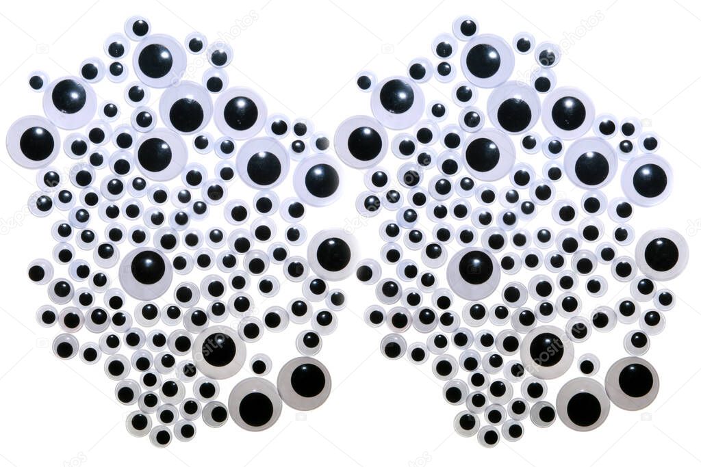 Googly Eyes. Googly plastic eyes pattern on a white background. Used for imitation of eyeballs for handcraft toys and dolls and others creativity. isolated on white. room for text. clipping path. 