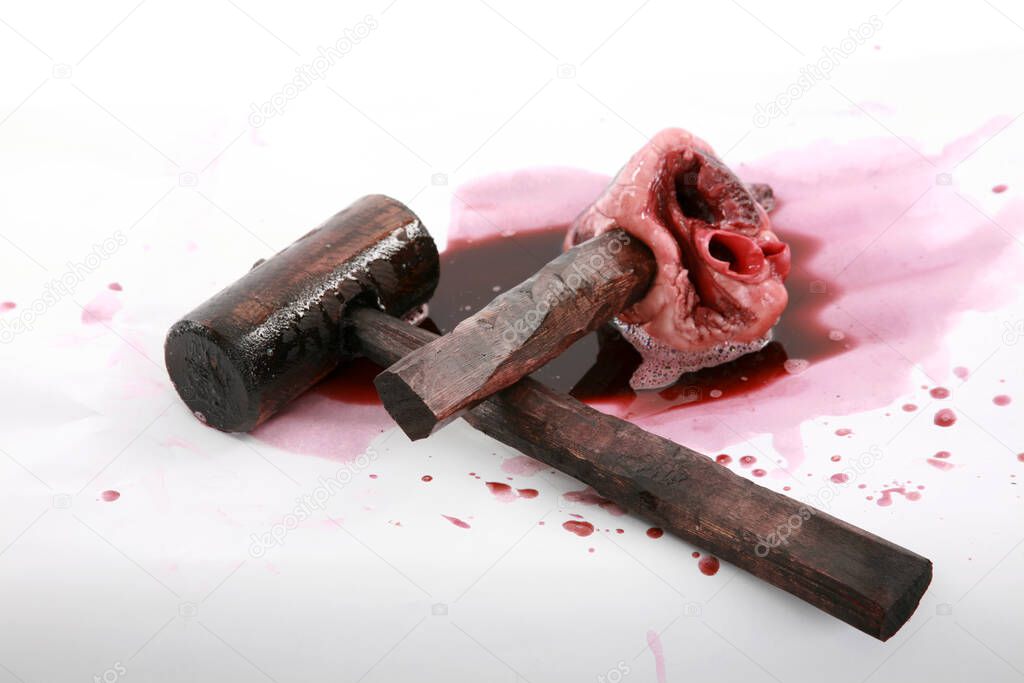 Vampire Heart. The beating Undead Heart of a Vampire. Isolated on white. Room for text. Clipping Path. A good person drives a Wooden Stake into the beating heart of an evil Vampire to end its rein of terror and destruction. Vampire Killers. Halloween