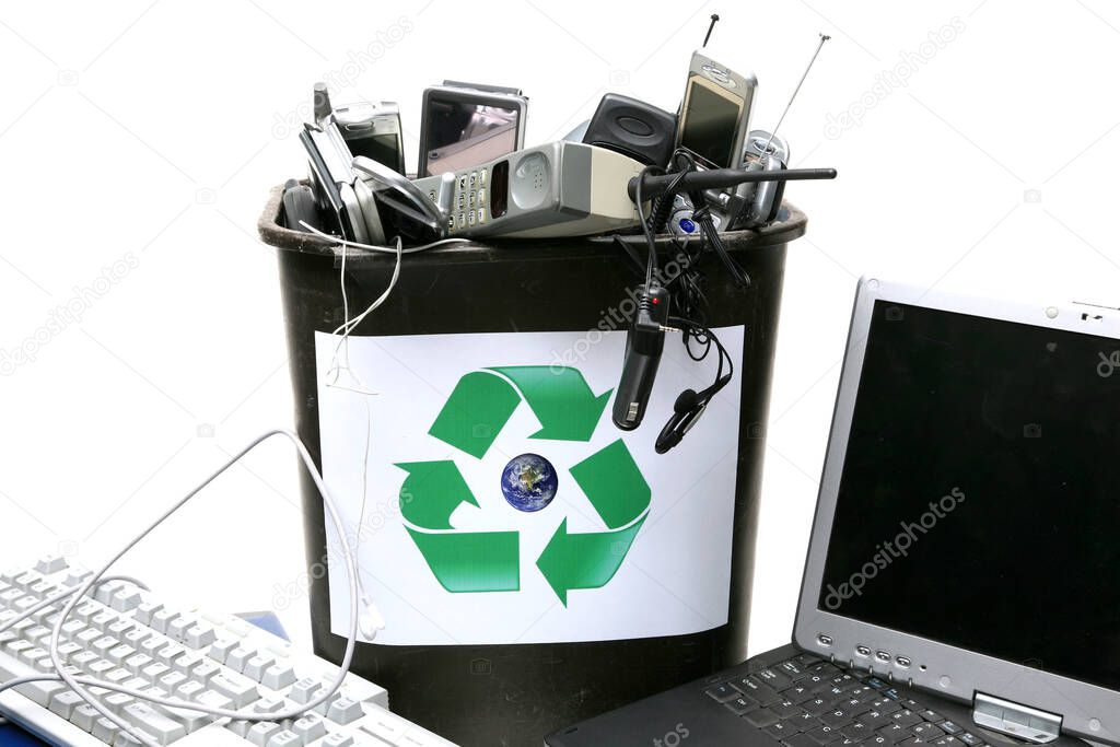 Electronic Recycling. Electronic waste ready for recycling. E-Waste. old used electronic devices recycled and reused. Recycling of old Cellular Telephones. Recycling of old Laptop Computers. Recycling of old E-Waste. Electronic Waste recycling. 