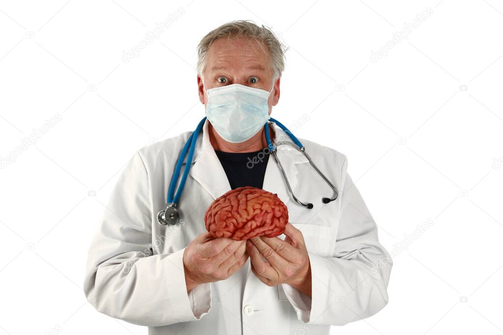 brain surgeon. medical and science.  a doctor or brain surgeon holds a brain with a strange confused look on his face. isolated on white. room for your text. A brain surgeon is shocked at what a separated brain is telling him telepathically. 