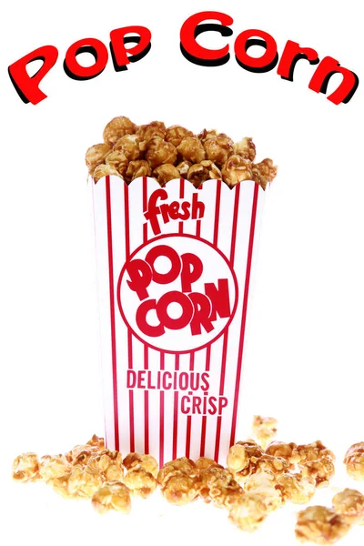 Caramel Popcorn. Caramel popcorn in a decorative paper popcorn cup. Popcorn. Caramel flavored Pop Corn in a Red and White Striped Paper Container. Isolated on white. Room for text. Clipping Path. Caramel Popcorn is enjoyed by happy people world wide.