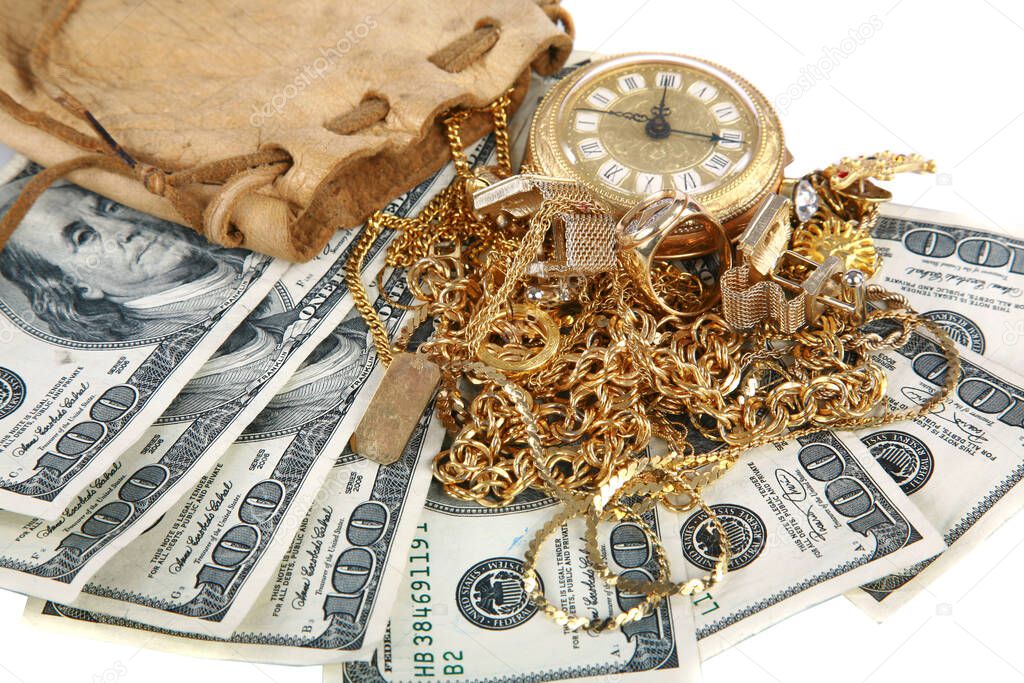 Cash For Gold. Cash 4 Gold. old jewelry on the money. Cash for Old Gold Jewelry and Diamonds. Cash with old gold in a leather pouch. Isolated on white. Room for text. Clipping path. leather pouch filled with gold jewelry lays upon a pile of cash. 